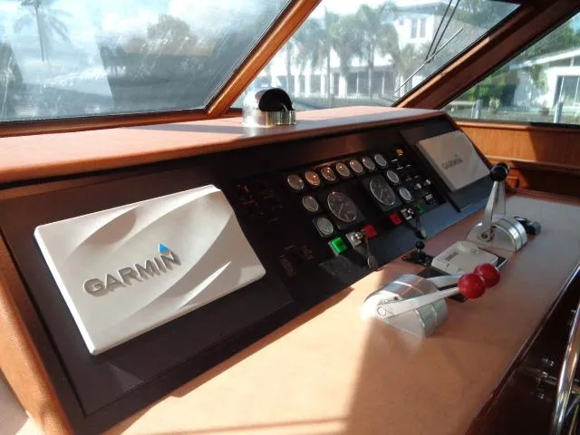 Slide: The Image of Hatteras 67 Cockpit Motor Yacht 1989 helm with Garmin navigation system and control panel. - 3