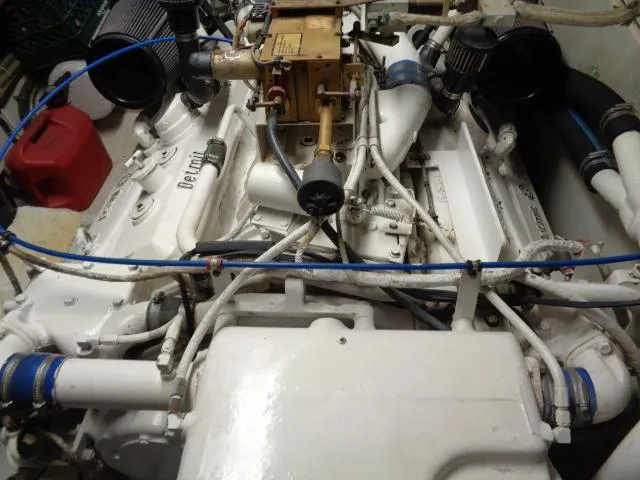 Slide: The Image of Engine room of 1989 Hatteras 67 Cockpit Motor Yacht with visible components and wiring. - 30