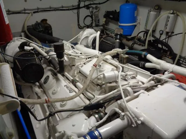 Slide: The Image of Engine room of 1989 Hatteras 67 Cockpit Motor Yacht with visible machinery and components. - 33