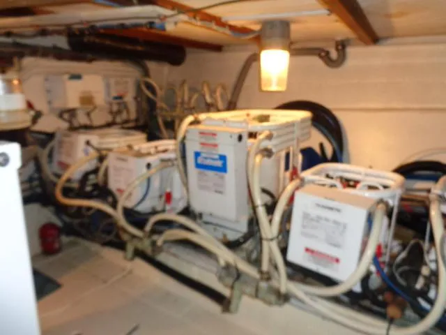 Slide: The Image of Engine room of 1989 Hatteras 67 Cockpit Motor Yacht with machinery and wiring. - 37