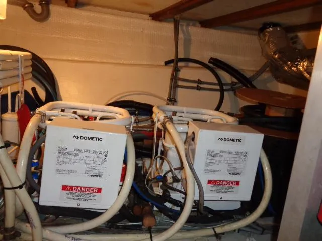 Slide: The Image of Engine room of 1989 Hatteras 67 Cockpit Motor Yacht with Dometic equipment. - 38