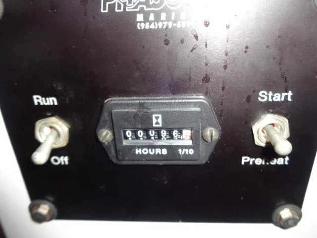 Slide: The Image of Control panel of 1989 Hatteras 67 Cockpit Motor Yacht with hour meter and switches. - 40