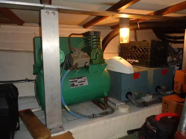 Slide: The Image of Engine room of 1989 Hatteras 67 Cockpit Motor Yacht with equipment and lighting. - 41