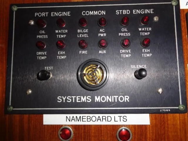Slide: The Image of Hatteras 67 Cockpit Motor Yacht 1989 systems monitor panel with engine indicators. - 5