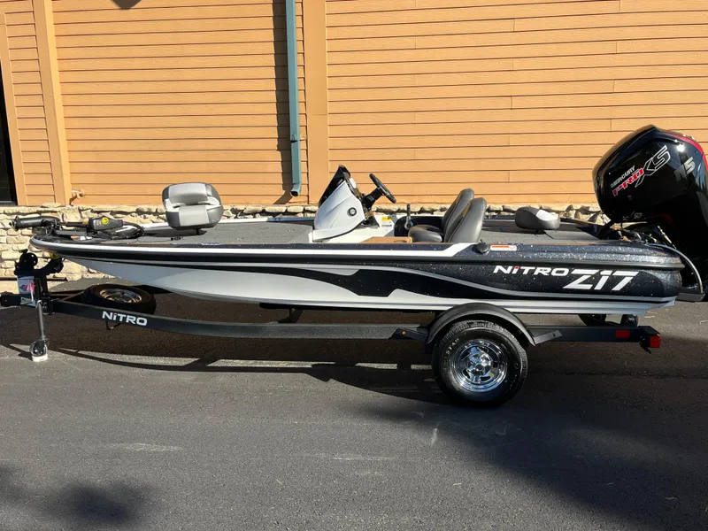 The Image of 2025 Nitro Z17 fishing boat on trailer, parked outdoors. - 0