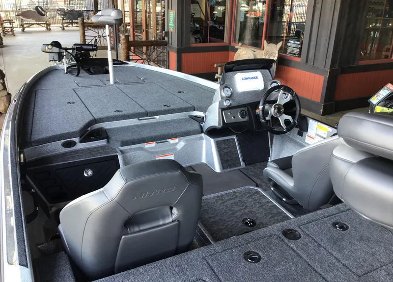Slide: The Image of 2025 Nitro Z21 XL boat interior with modern dashboard and seating. - 3