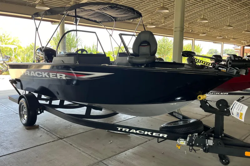 The Image of 2025 Tracker Pro Guide V-175 Combo boat on trailer in covered area. - 0