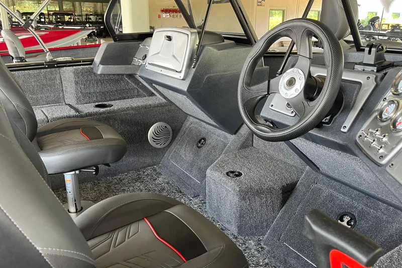 Slide: The Image of Interior of 2025 Tracker Pro Guide V-175 Combo boat with steering wheel and seats. - 4