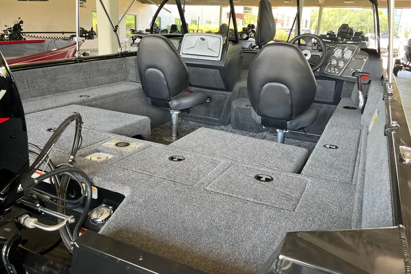 Slide: The Image of 2025 Tracker Pro Guide V-175 Combo boat interior with seating and control panel. - 5