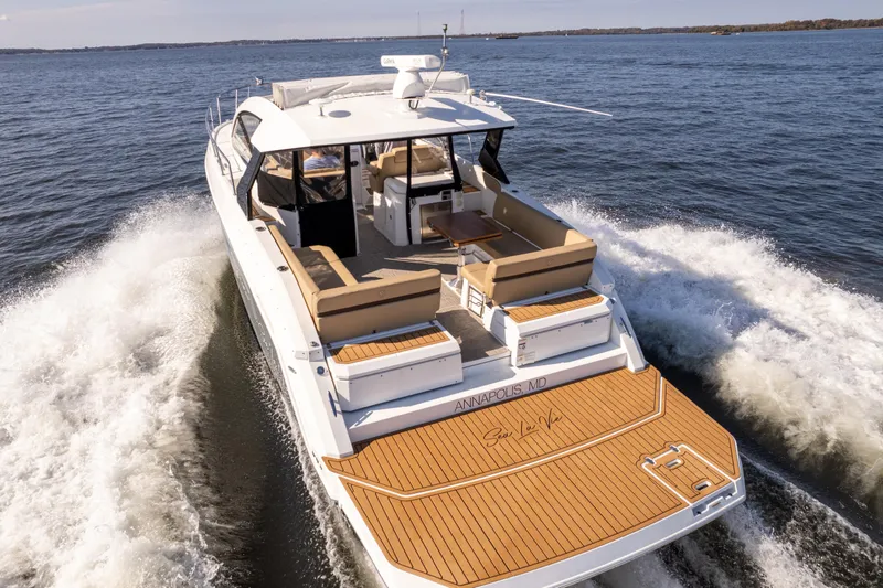 Slide: The Image of 2017 Cruisers Yachts 390 Express Coupe cruising on open water. - 28