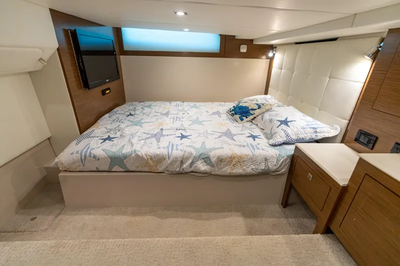 Slide: The Image of Luxurious 2017 Cruisers Yachts 390 Express Coupe bedroom with starfish bedding and modern decor. - 46