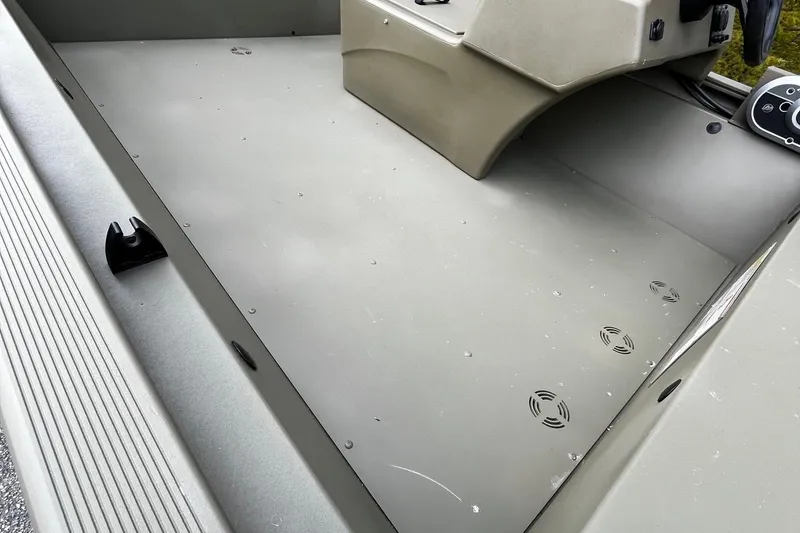 Slide: The Image of 2025 Tracker Grizzly 1648 SC boat interior, showcasing spacious deck and control console. - 7