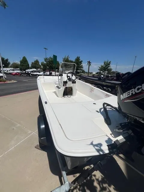 Slide: The Image of 2025 Mako Pro Skiff 17 CC boat on trailer, outdoor display. - 3