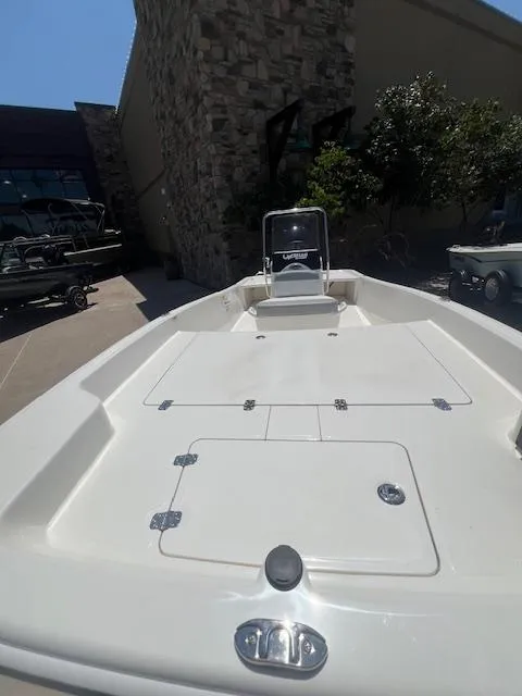 Slide: The Image of 2025 Mako Pro Skiff 17 CC boat, white deck, outdoor display. - 5
