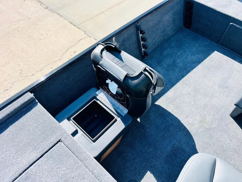 Slide: The Image of 2025 Tracker Bass Tracker Classic XL interior with storage compartment and seating. - 20