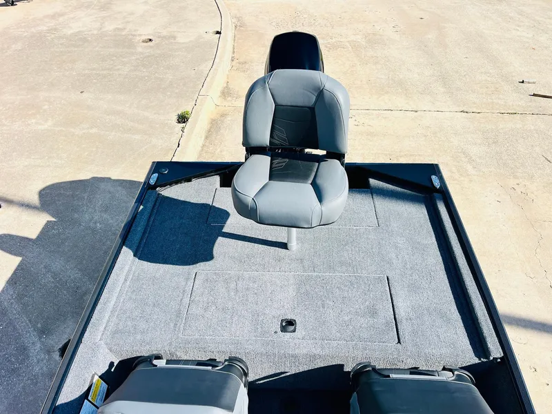 Slide: The Image of 2025 Tracker Bass Tracker Classic XL boat with gray seating and spacious deck. - 26