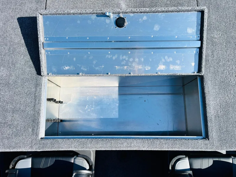 Slide: The Image of Open storage compartment in 2025 Tracker Bass Tracker Classic XL boat. - 29