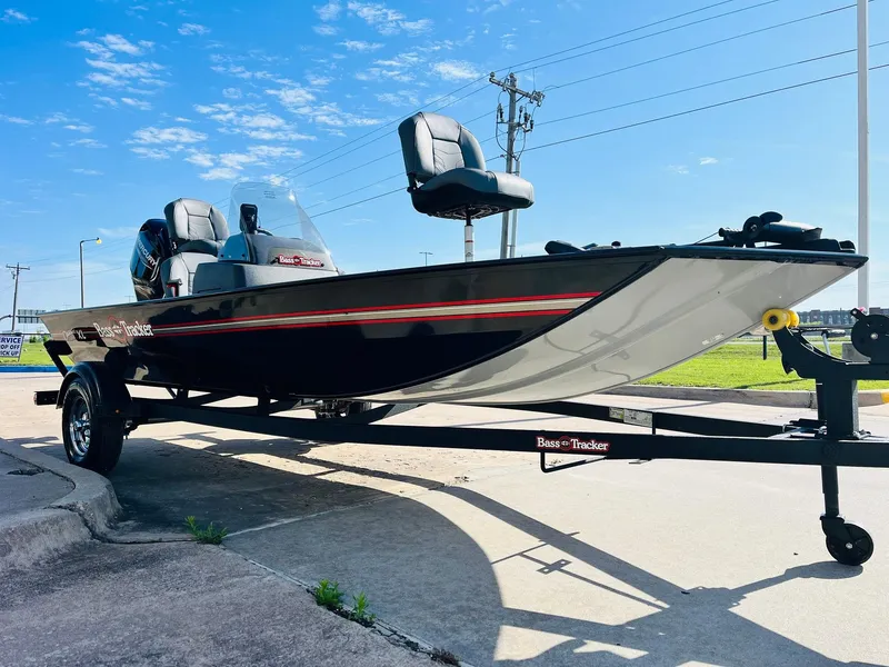 Slide: The Image of 2025 Tracker Bass Tracker Classic XL boat on trailer, parked outdoors under blue sky. - 3