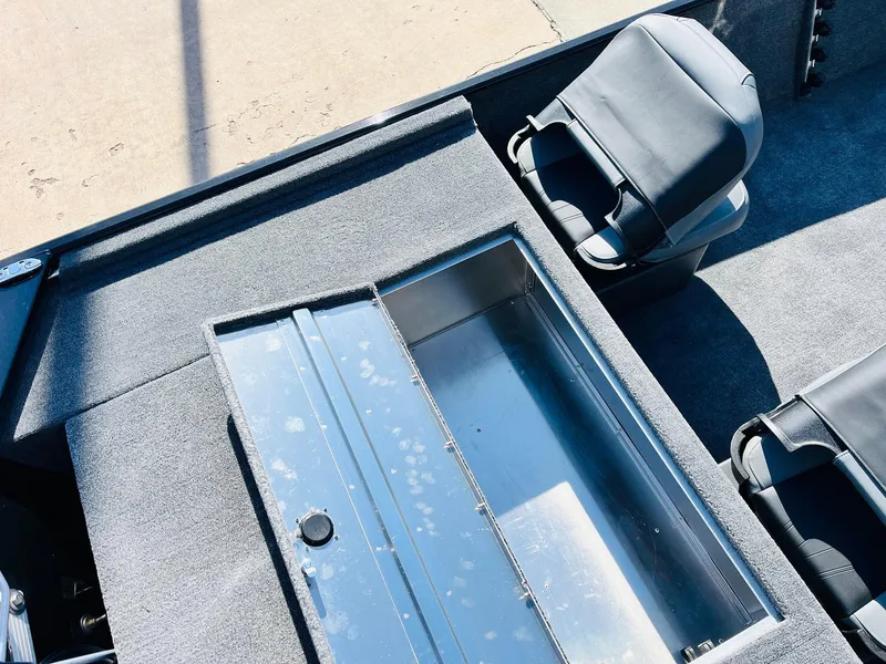 Slide: The Image of Interior of 2025 Tracker Bass Tracker Classic XL boat with seating and storage compartment. - 30