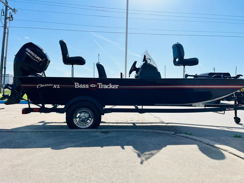 Slide: The Image of 2025 Tracker Bass Tracker Classic XL boat on trailer, side view, sunny day. - 4