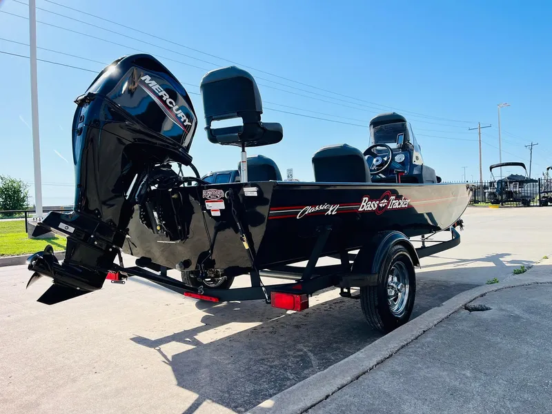 Slide: The Image of 2025 Tracker Bass Tracker Classic XL boat with Mercury engine on a trailer. - 5