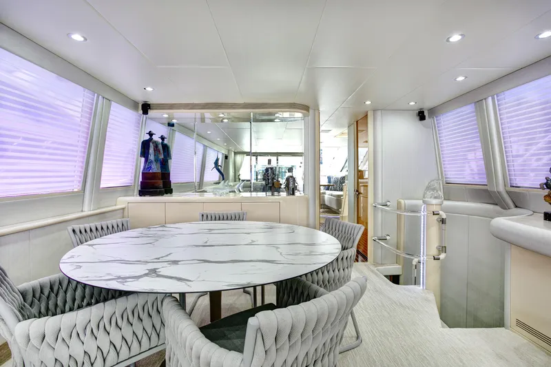Slide: The Image of Luxurious interior of 1994 Lazzara 76 yacht with elegant dining area and modern decor. - 10