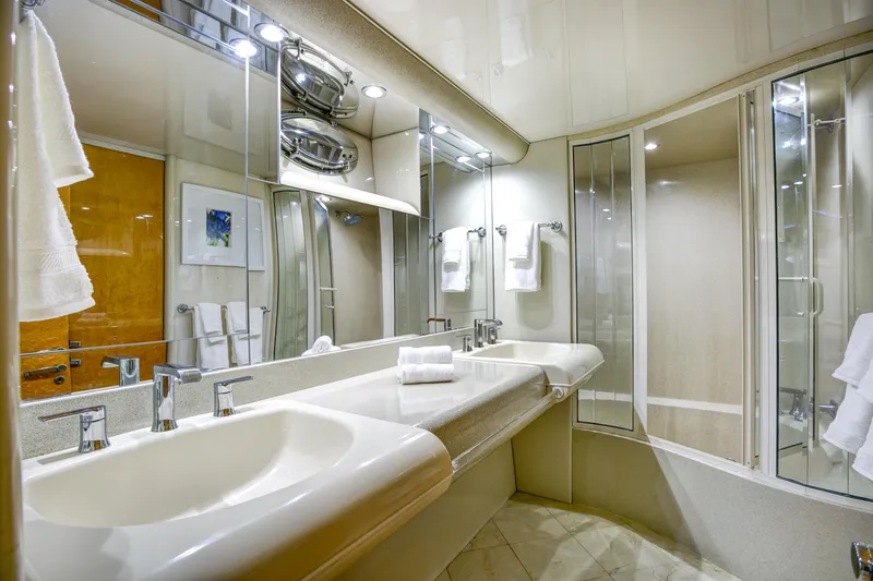 Slide: The Image of Luxurious bathroom in a 1994 Lazzara 76 yacht with dual sinks and modern fixtures. - 17