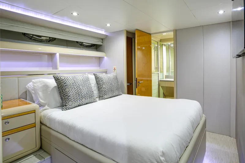 Slide: The Image of Luxurious bedroom interior on 1994 Lazzara 76 yacht with modern design and cozy bedding. - 18