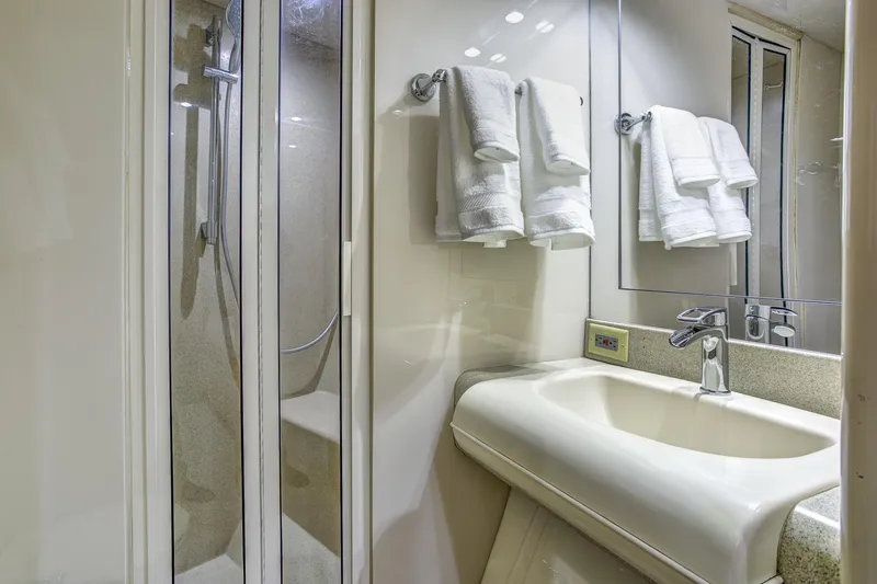 Slide: The Image of Luxurious bathroom in 1994 Lazzara 76 yacht with shower and elegant sink. - 19