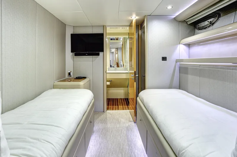 Slide: The Image of Luxurious 1994 Lazzara 76 yacht cabin with twin beds and modern amenities. - 20