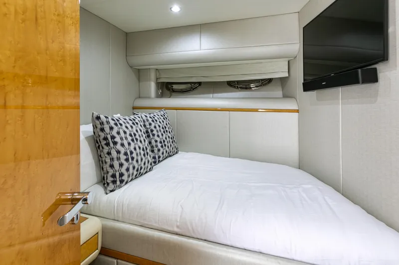 Slide: The Image of Luxurious bedroom interior of 1994 Lazzara 76 yacht with modern decor and TV. - 22