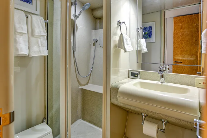 Slide: The Image of Luxurious bathroom in 1994 Lazzara 76 yacht with shower and sink. - 28