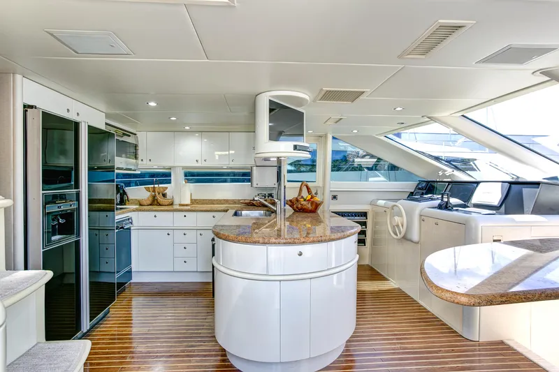 Slide: The Image of Luxurious 1994 Lazzara 76 yacht interior with modern kitchen and sleek design. - 7