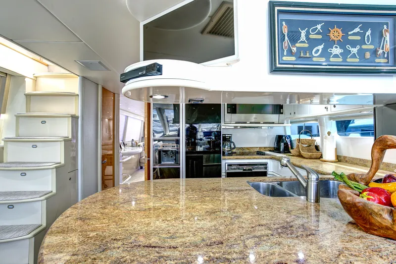 Slide: The Image of Luxurious 1994 Lazzara 76 yacht kitchen with granite countertops and modern appliances. - 9