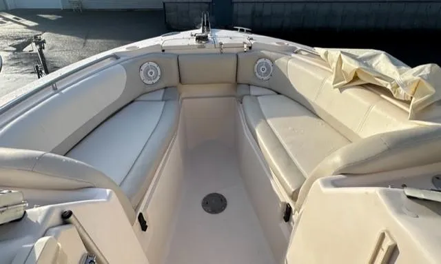 Slide: The Image of 2011 Grady-White Freedom 275 boat interior with cushioned seating. - 3