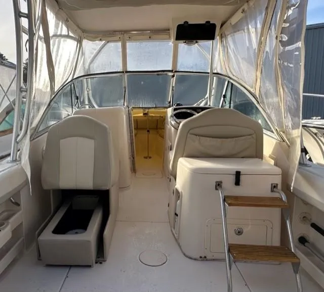Slide: The Image of Interior of 2011 Grady-White Freedom 275 boat with seating and helm. - 4
