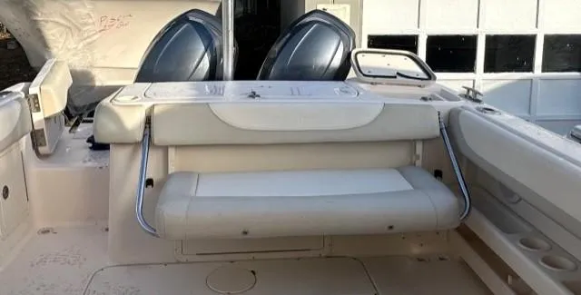 Slide: The Image of 2011 Grady-White Freedom 275 boat interior with seating and storage. - 5