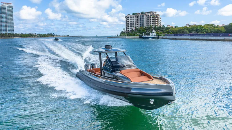 Slide: The Image of 2025 Capelli STRADIVARI 43 luxury boat cruising on a sunny day. - 20