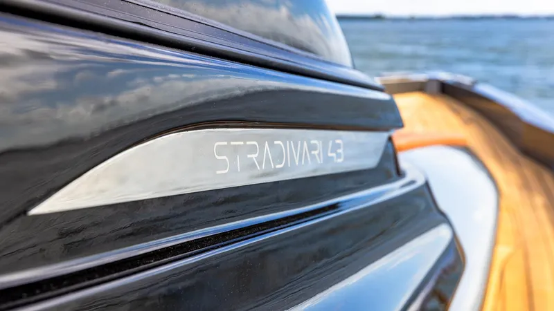Slide: The Image of Close-up of 2025 Capelli STRADIVARI 43 yacht nameplate with ocean background. - 27