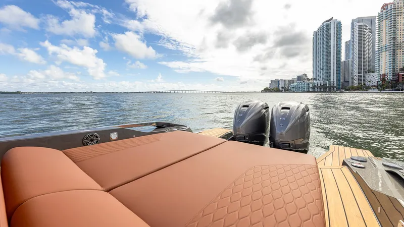 Slide: The Image of Capelli STRADIVARI 43 boat, 2025 model, with city skyline and ocean view. - 28