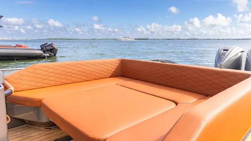 Slide: The Image of Luxurious Capelli STRADIVARI 43 yacht interior, 2025 model, with orange seating on open water. - 32