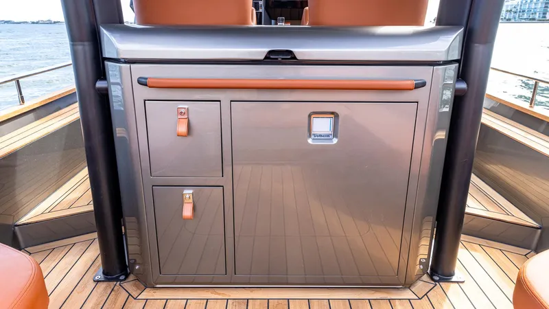 Slide: The Image of 2025 Capelli STRADIVARI 43 yacht interior with sleek cabinetry and leather accents. - 36