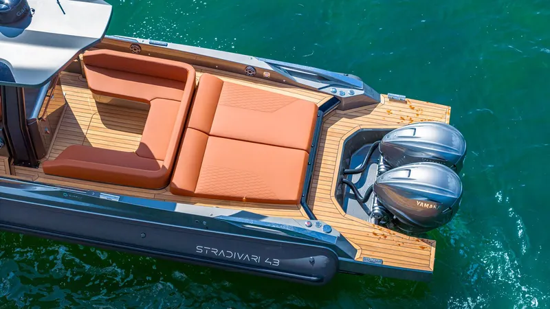 Slide: The Image of 2025 Capelli STRADIVARI 43 luxury boat with twin Yamaha engines and elegant deck seating. - 4