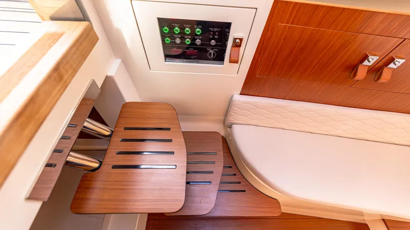 Slide: The Image of Interior of 2025 Capelli STRADIVARI 43 yacht with wooden steps and control panel. - 49