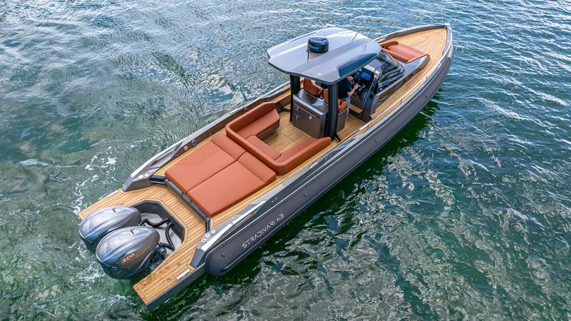 Slide: The Image of 2025 Capelli STRADIVARI 43 luxury boat on water, featuring sleek design and twin engines. - 8