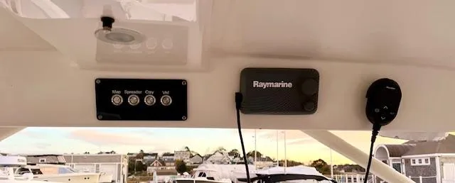 Slide: The Image of Century 24 Resorter 2020 boat dashboard with Raymarine equipment and control panel. - 11