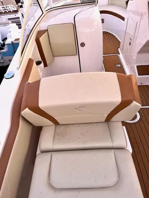 Slide: The Image of Century 24 Resorter 2020 boat interior with beige and brown seating, wooden flooring. - 17