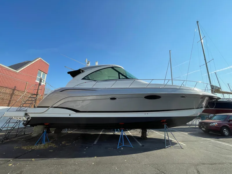 Slide: The Image of 2014 Formula 45 Yacht on stands in a marina, clear blue sky background. - 19