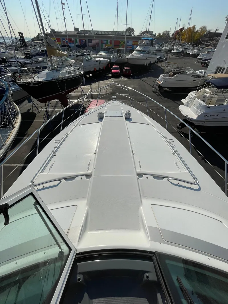 Slide: The Image of 2014 Formula 45 Yacht docked among other boats at a marina. - 21