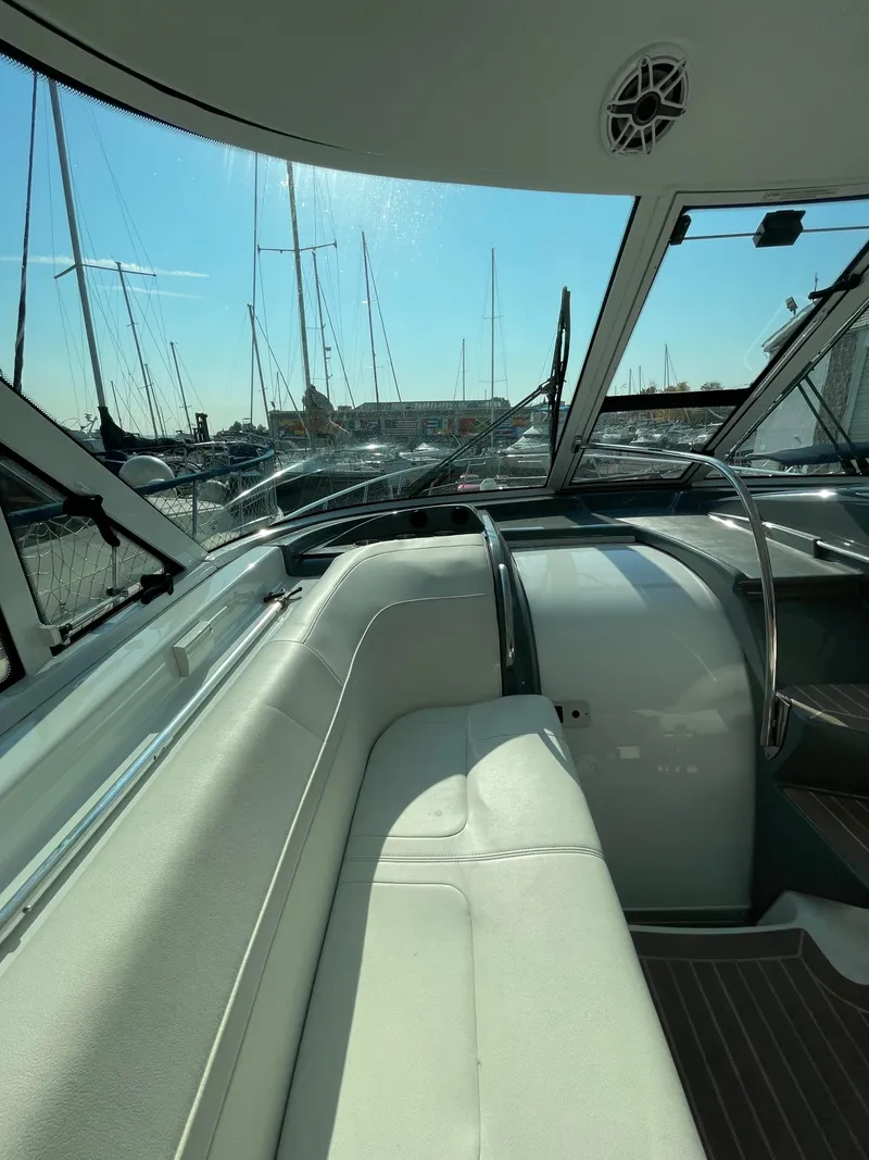 Slide: The Image of 2014 Formula 45 Yacht interior with marina view, featuring sleek seating and modern design. - 6